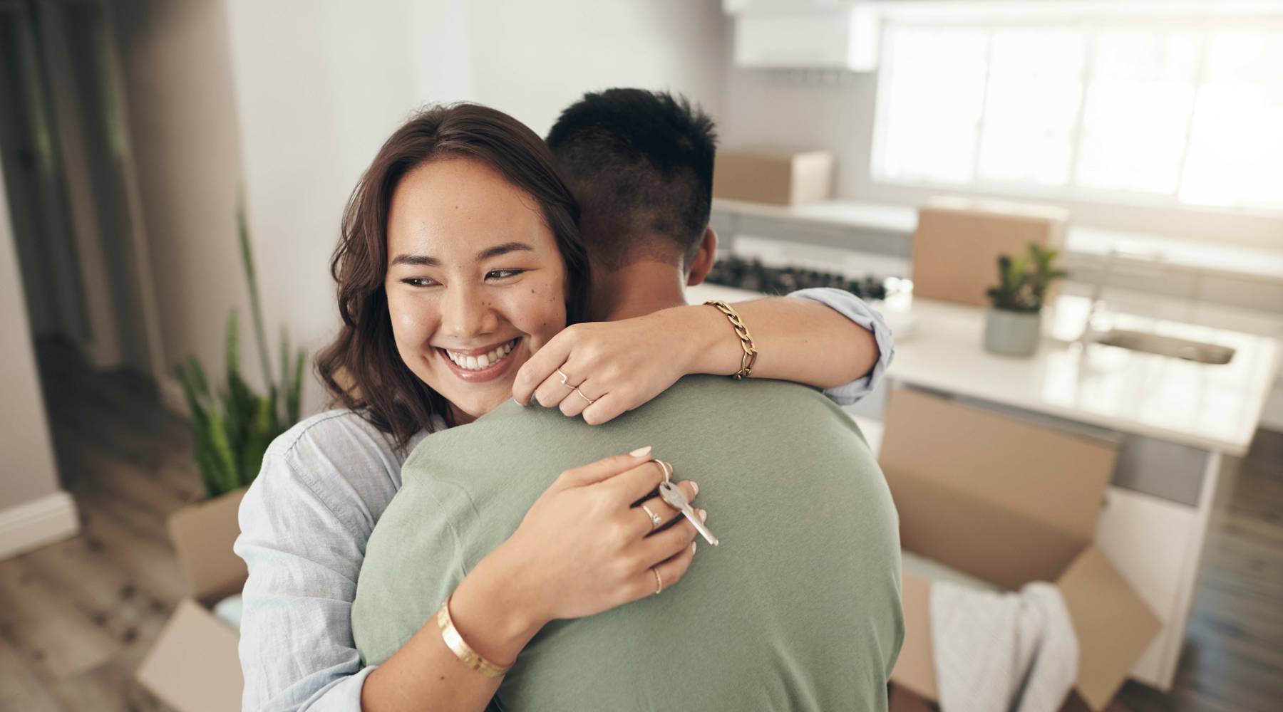 Couple Hugging In Kitchen 2411289729 5781392