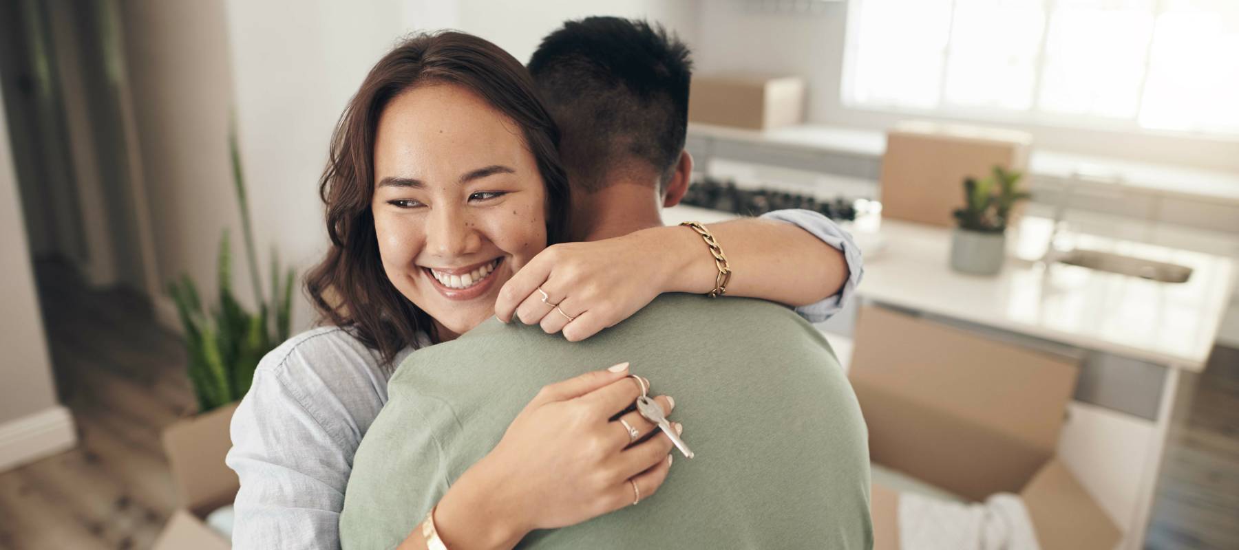 Couple Hugging In Kitchen 2411289729 5781392